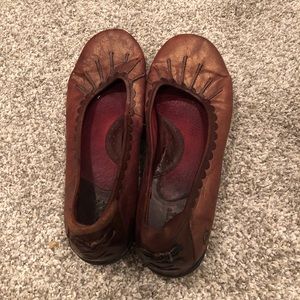 Brown leather flats